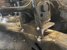 Started with some 1/4" angle. Will box it in once it is in the right spot.the piece I trimmed off should work fine.
I will mill it down to fit, round the corner to fit the angle and weld it in place.
When the brakes are applied, LOTS of force tries to rip the top mount up and forward. So I don't want this connection to the frame to be weak !!