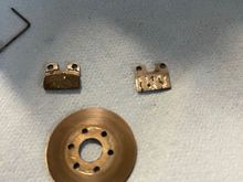 You can see here how one side of the brake actuator is missing brake pad material.

I found some extra brake looking stuff from my RC car stuff and made the magic happen. 

The brakes worked incredible after putting the new brake material on.