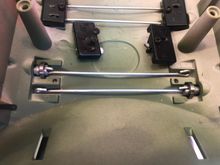 Torsion bars and black plastic "lock down" covers.