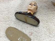 Normally, I would just glue the pilot in with silicon caulk or canopy glue. I wanted this one to be removable in case the winner of this model wanted to personalize it. Here, the cardboard pattern is ready to attach to the pilot with double-faced tape.