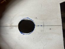 I started with a 1" hole, but had to elongate it for the elbow to fit down under.