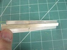 Balsa strips and double-faced tape used to hold alignment of blades -