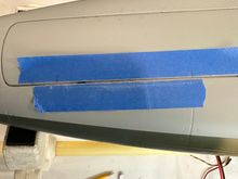 Trimming nose gear door so it can open fully.