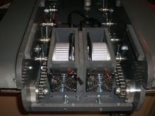 40 pitch chain.  5/8" go kart hubs with bearings.  Each motor is mounted in a sliding "tray" so the drive chains can be tensioned independently.  Overall track tension is done on the front idler wheels.