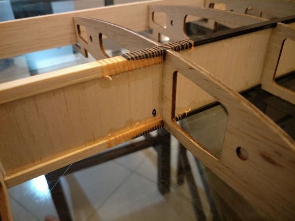 The length of halfspan is 900mm. I glued 3 pieces of  6mm widex1mm thick carbon fiber stick. Its only 750mm long, so I spliced it with pine I recover from used packaging material then  I add some fishing line at the splice. 