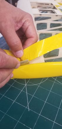 Material is pulled up against razor one blade-length at a time -