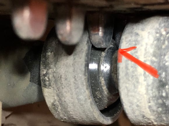 Guide teeth hitting return roller “axle” causing grinding sound. The guide teeth are hit all the return roller as shown here. 