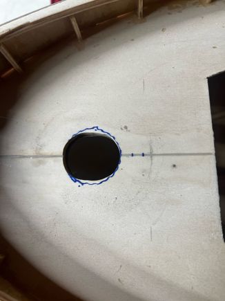 I started with a 1" hole, but had to elongate it for the elbow to fit down under.