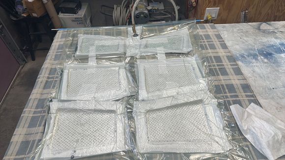 Flap and rudder molds in the vacuum bag.  20” of vacuum