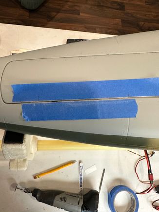 Trimming nose gear door so it can open fully.