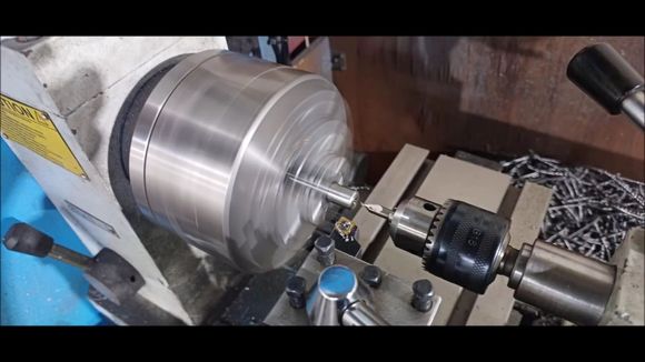 Set the center with a lathe machine.