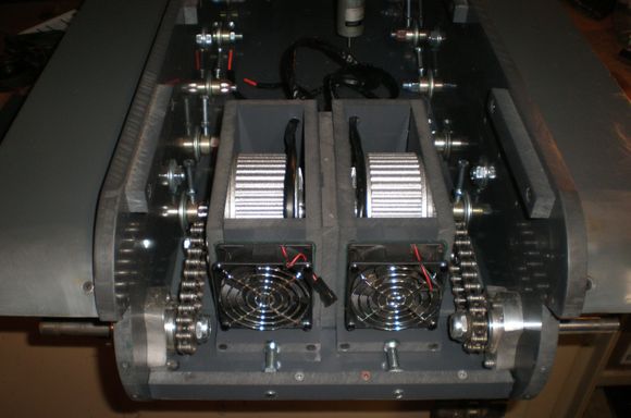 40 pitch chain.  5/8" go kart hubs with bearings.  Each motor is mounted in a sliding "tray" so the drive chains can be tensioned independently.  Overall track tension is done on the front idler wheels.
