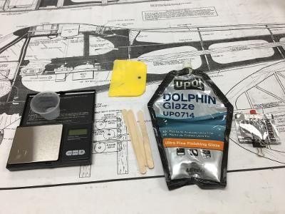 Here's what you need to use Dolphin Glaze. From left to right: mixing cup, micro scale, plastic spreader (for large areas), mixing sticks (for blending and dabbing), glaze, and hardener.