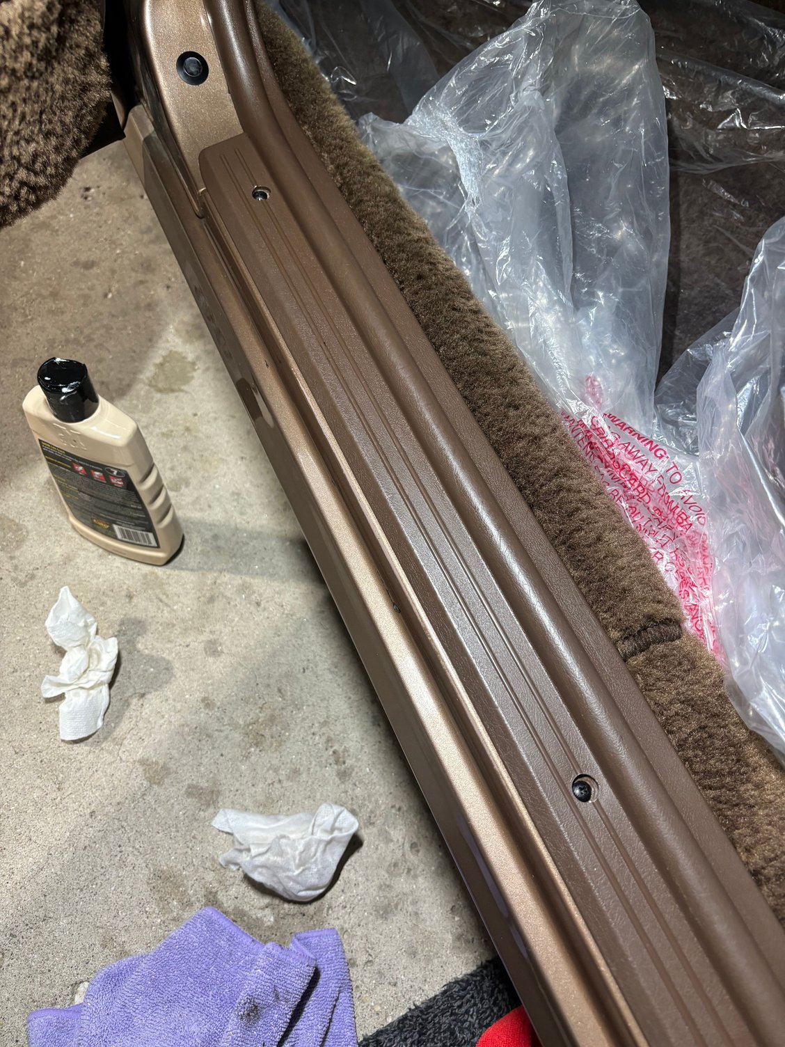 Repainted screws holding down panel