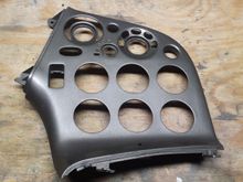 Front view of the HVAC/Radio panel. Whoever fabricated this did a nice job, starting with a stock panel, then molded in a fiberglass panel where the radio opening was, cut the gauge openings and refinished the whole panel in a gunmetal/silvery color as seen here.