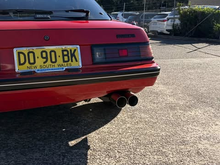 Twin stock tailpipes.
