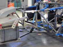 The next step was to take the car to Specialty Engineering in Delta , BC. They are a race shop specializing in roadracing but able to work on anything you can dream up. Their hand built in house tube frame chassis have won several SCCA National championships. While the car was there I had them clean up the rear suspension , add the electric power steering, and set the bump steer. The crashbox was set at a slight angle to increase downforce.