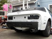 White primer rattle can rear half of car