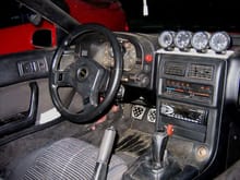 Inside dirty Turbo II. GReddy gauges.