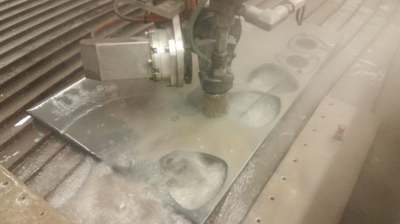 when you are building your own exhaust and you have all sorts of cool tools at your disposal.. why not flowjet out your own flanges... and make them rotor shaped while youre at it