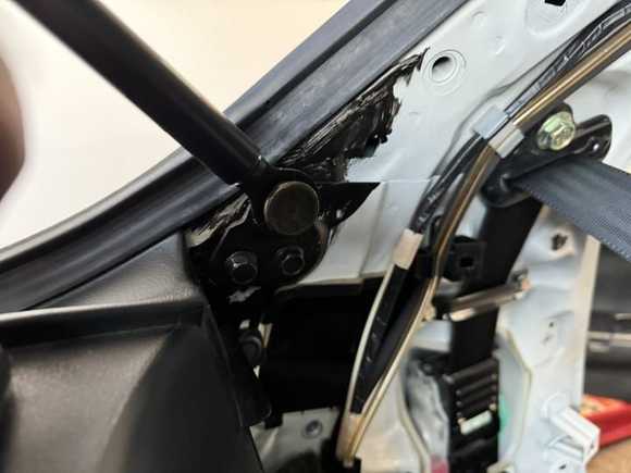 Taking apart the interior to get to the gas strut Hatch brackets I decided to unbolt everything and use a box wrench to break loose the ball on the hatch no need to pry it off the gas strut since it will be replaced. 