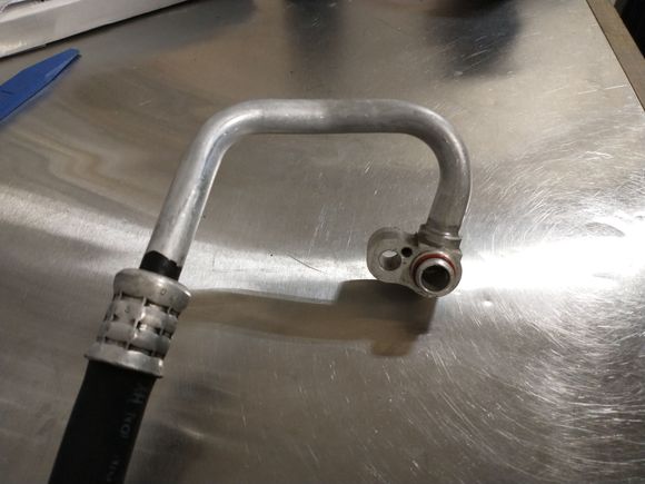 Close up of the OEM suction hose, before salvaging the fitting end