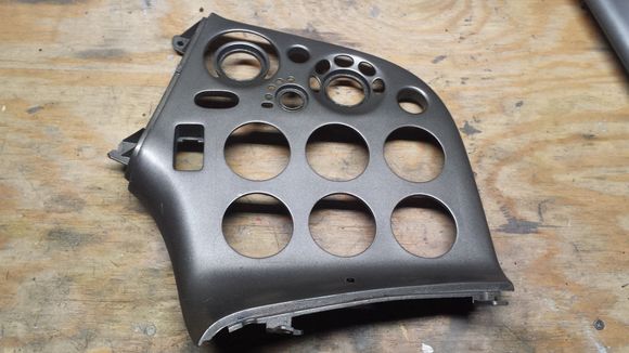 Front view of the HVAC/Radio panel. Whoever fabricated this did a nice job, starting with a stock panel, then molded in a fiberglass panel where the radio opening was, cut the gauge openings and refinished the whole panel in a gunmetal/silvery color as seen here.
