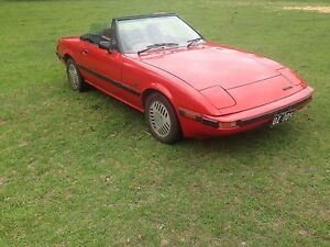 This car which was for sale many years ago in Australia.  The wheels interest me and I am not sure what they are - a variant of the Mazda rotor wheels or Delta brand?