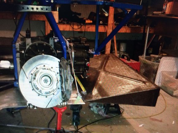 I believe we built this at a 13 degree angle which was supposed to be most efficient for a diffuser of this length. The whole car is flat bottomed and with the fuel tank in front of the rear wheels this should add a lot of down force