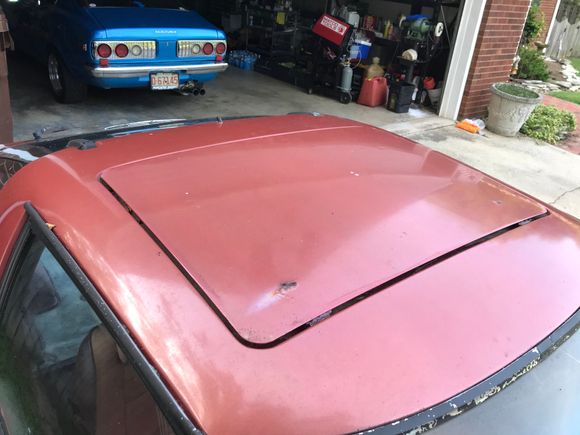 small spot of rust on sunroof panel, there is a smaller one on the driver side, same area.