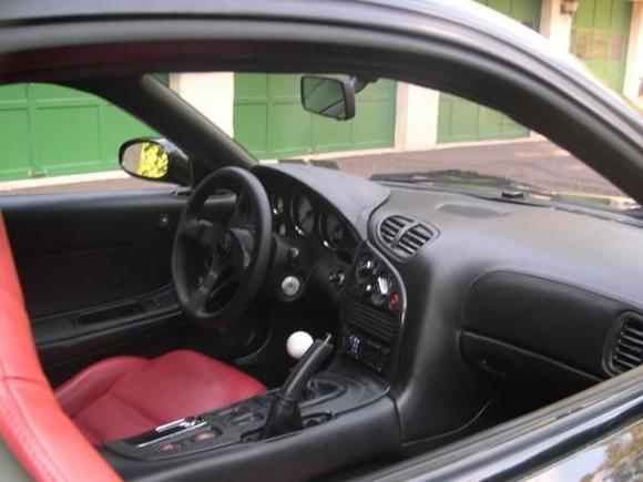 Nice shot showing the black leather covering the dash and console and the metal plated console and dash painted wrinkle finish black.  (DSCN2536)