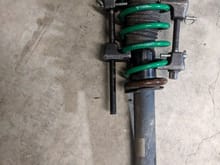 Using spring-compressors rented from AutoZone to remove the springs from the struts, early 2019