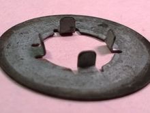 Another view of the rear caliper bracket washer I'm hoping to verify that it belongs on the car.