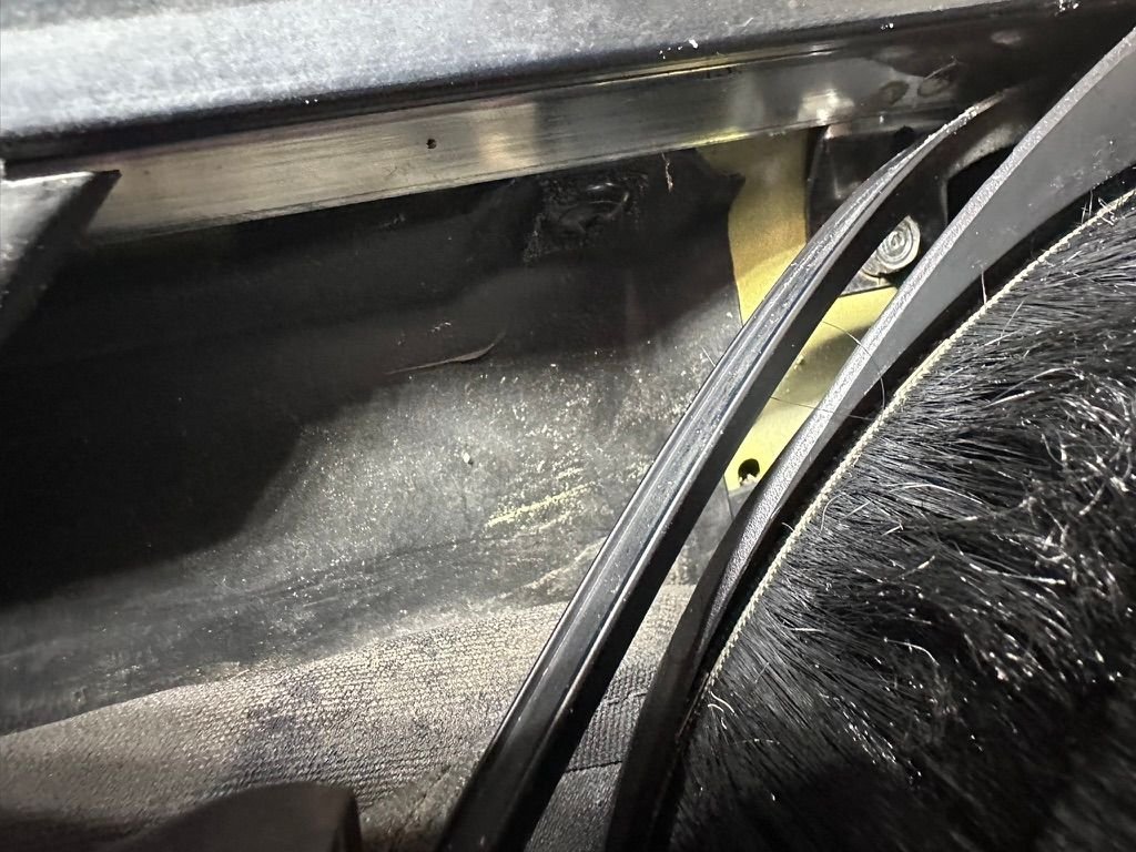 This metal bar is where the rubber needs to go. It's a PAIN. 