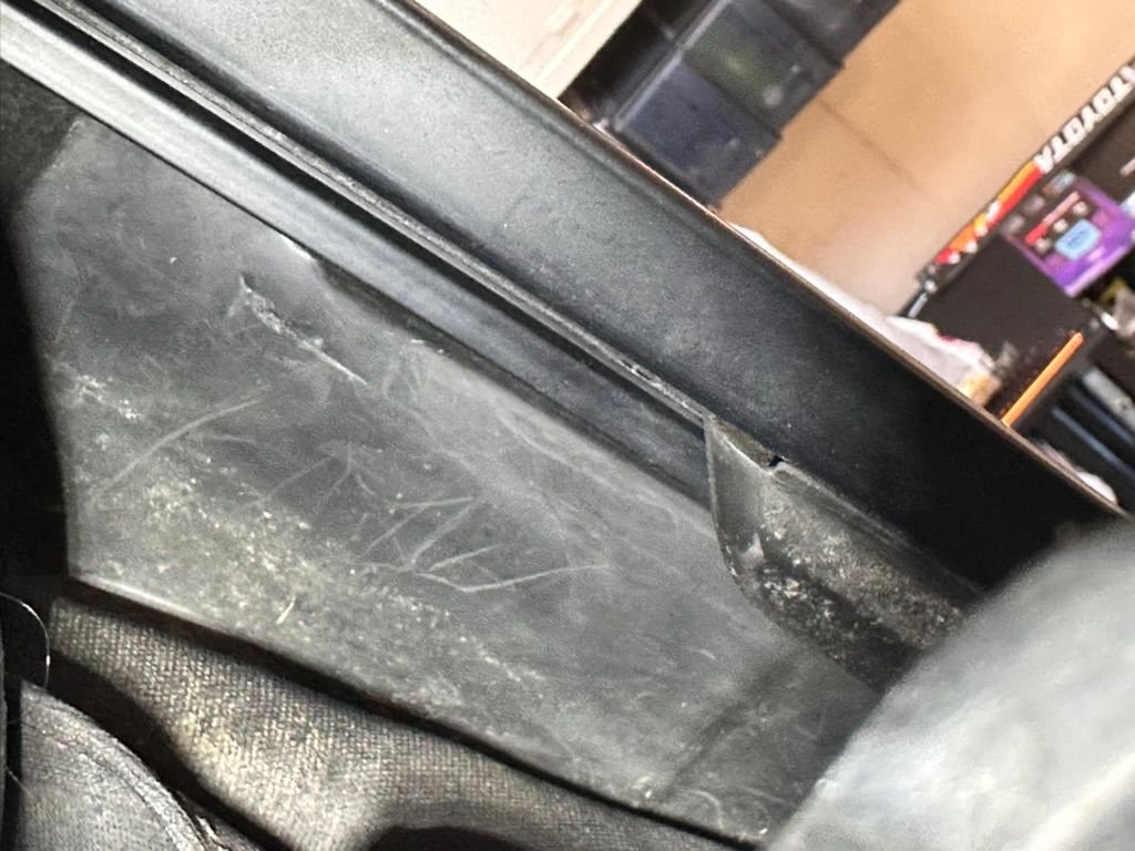 Here it is attached to the metal rail. Researching the part, I guess it comes as a kit for the convertible top weather seal. The alternative is to install it when replacing the top. It is possible to do it with the top on, like I did, just challenging when tucking it into place. 