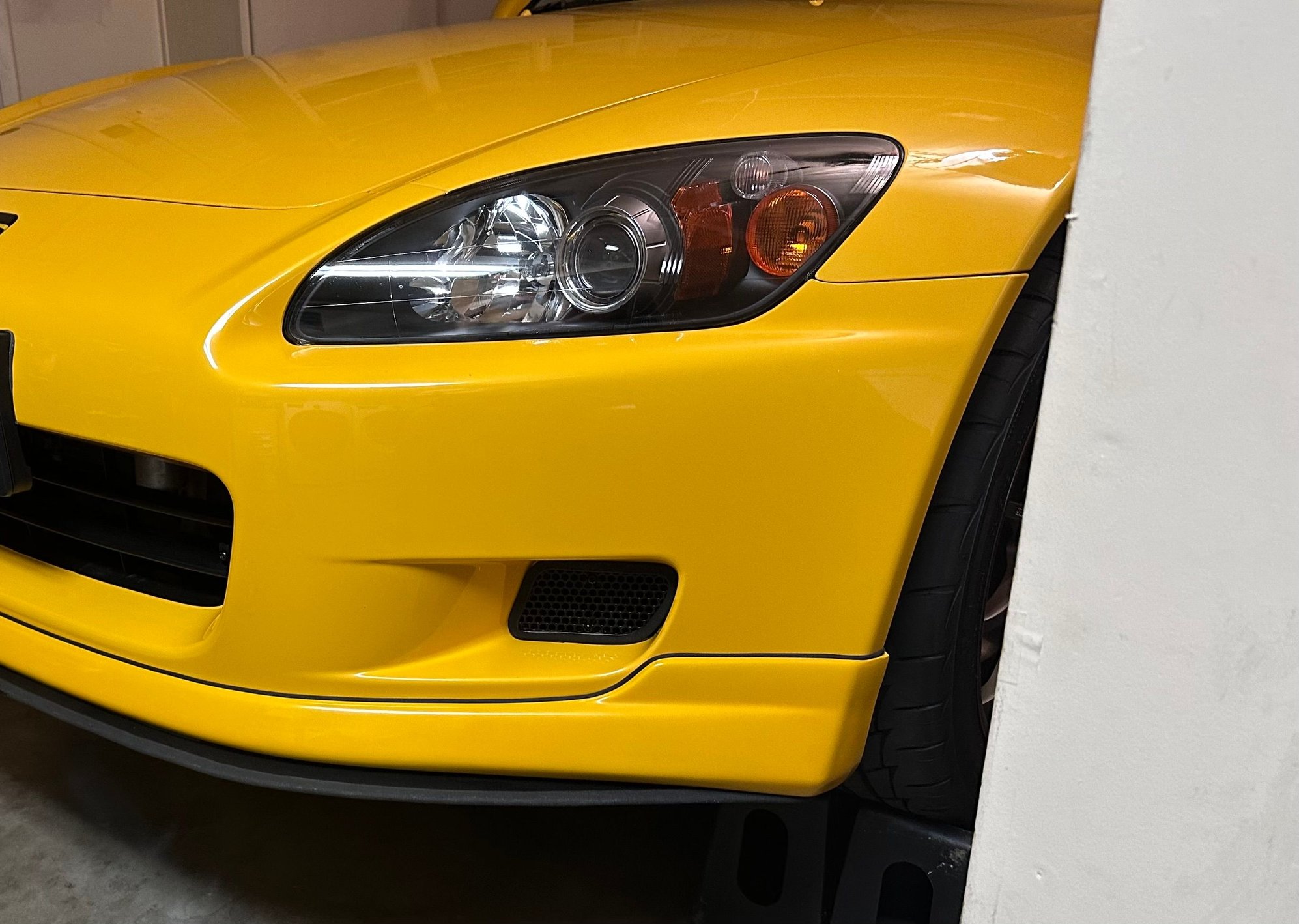 Here is the lip fitted with Honda OEM weather seal, front splitter. After 2K clear, had to wet sand and polish/buff. 