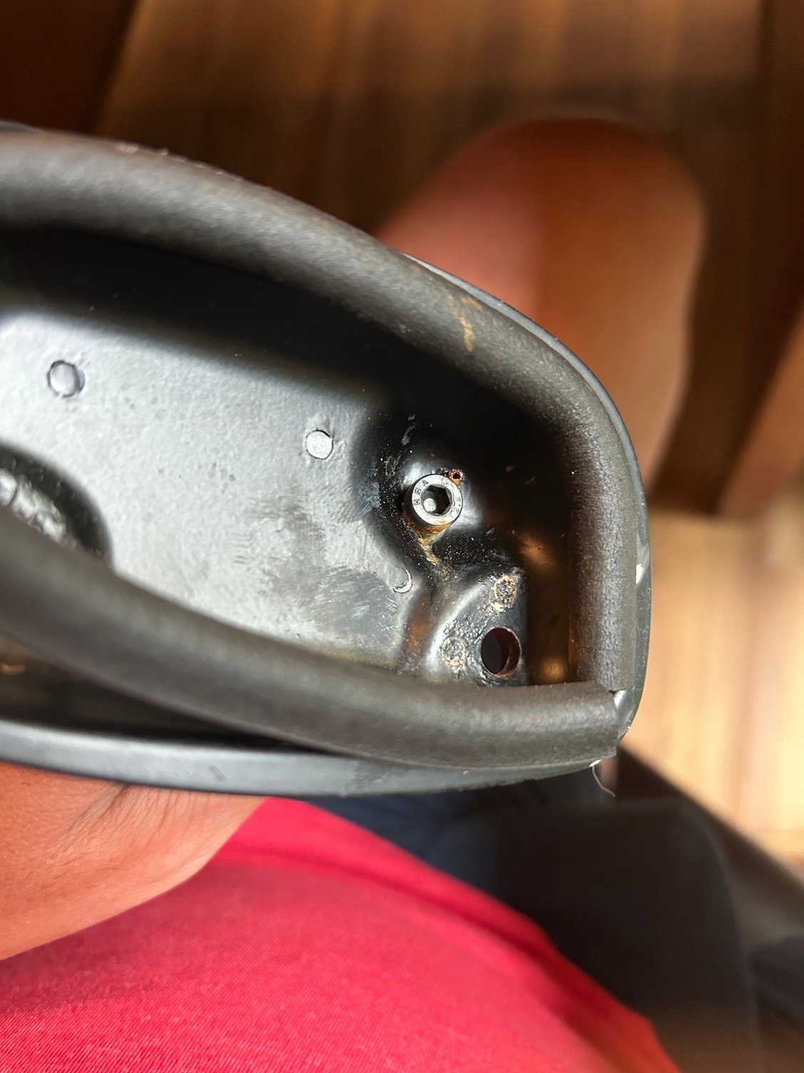 This is the better of the two. Notice the small rusty pin at roughly the 1 O’clock on the Allen bolt. The corroded base is missing that pin