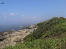 Nice area on Jamestown, RI.  Greenery, rocky shoreline and fog off in the distance.