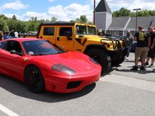 Ferrari and a Hummer. Different strokes, different folks!