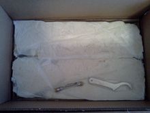 Foam packed, tools included -- no rear lower mounting bolt *nuts* though :(