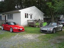 My friend and mechanic Bretts HKS SC MY05 and my car after many upgrades being installed.