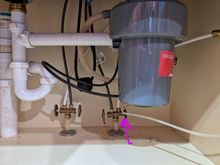 This is the valve that I think controls the water that goes to the fridge supply water. It's the one I closed.




