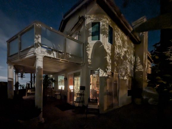 ^7-1-2025.  I like the plant shadows on my house from the neighbor's lights.  