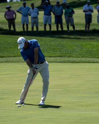 Ryan Palmer (I think).  Ball just off the club.  