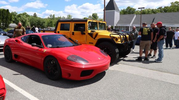 Ferrari and a Hummer. Different strokes, different folks!