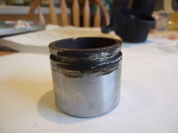 Passenger caliper piston