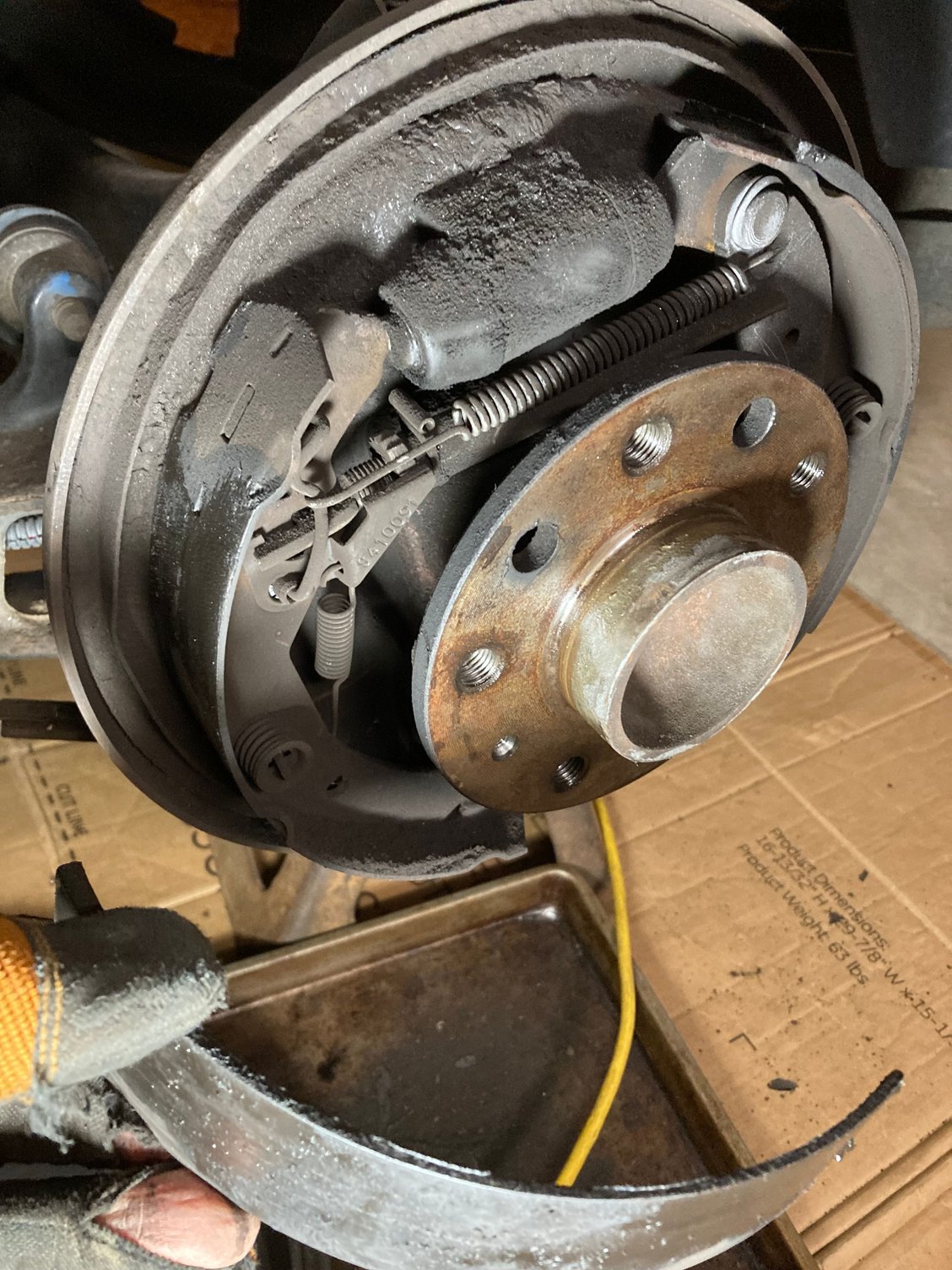 Leading shoe on drivers side fell off steel backing!