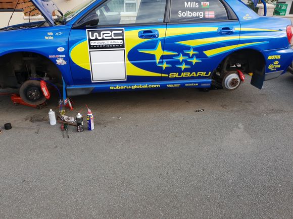 Car up on jacks to sort brakes out and fluss brake fluid.