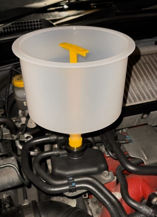 I used a kit like this, fill up to about a third and leave the engine running so the air has change to escape. 