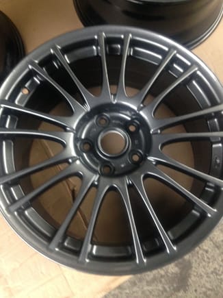 just picked up wheels had them powder coated in grey original wheels light as a feather next up four wheel alignment and bodyshop for undersealing and fr spoiler